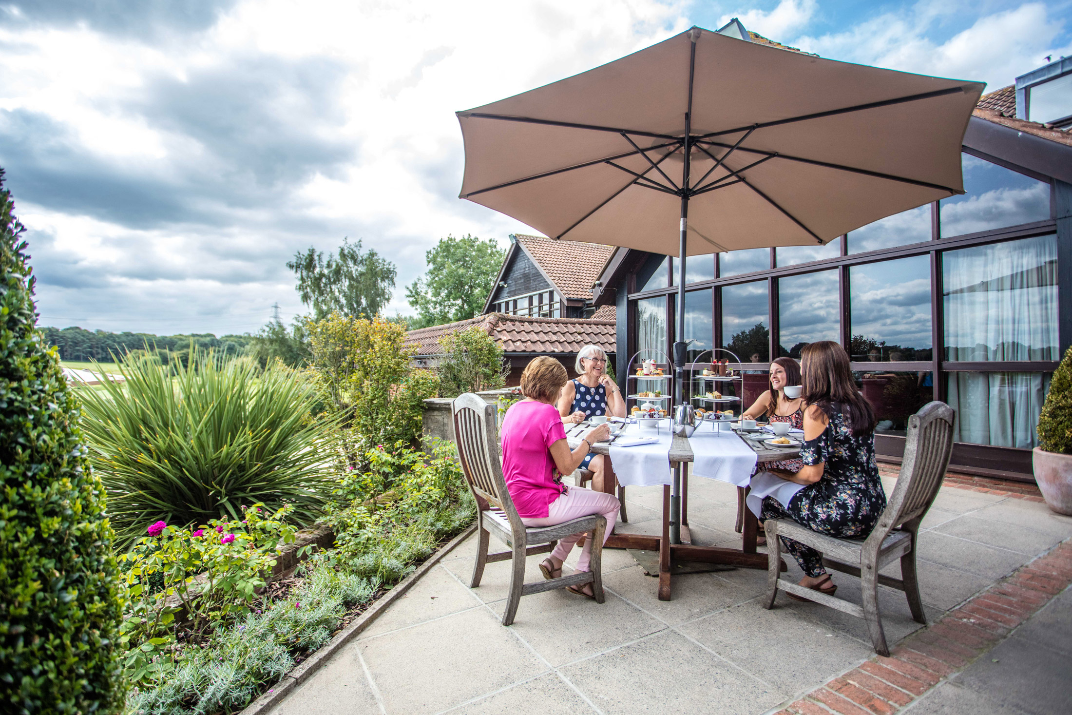 Ladies-enjoying-Afternoon-tea-on-the-terrace